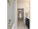 Bathroom features tile floors and shower with marble countertop vanity at 1850 Cotillion Dr # 2304, Dunwoody, GA 30338
