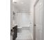 Bathroom features tile floors and shower with marble countertop vanity at 1850 Cotillion Dr # 2304, Dunwoody, GA 30338
