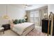 Bedroom with plush rug, neutral paint, and soft, natural light at 1850 Cotillion Dr # 2304, Dunwoody, GA 30338