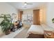 Bright bedroom featuring a large window, desk, and comfortable bed at 1850 Cotillion Dr # 2304, Dunwoody, GA 30338