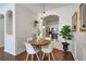 Cozy dining area with modern light fixtures and view into the well-equipped kitchen at 1850 Cotillion Dr # 2304, Dunwoody, GA 30338