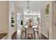 Dining area displays hardwood floors and a modern pendant lighting fixture at 1850 Cotillion Dr # 2304, Dunwoody, GA 30338