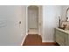 Inviting entryway with hardwood floors and a decorative dresser at 1850 Cotillion Dr # 2304, Dunwoody, GA 30338
