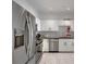 Bright kitchen features stainless appliances, granite countertops, and white cabinets at 1850 Cotillion Dr # 2304, Dunwoody, GA 30338