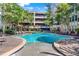 Resort-style pool with a lounge area in a beautiful community setting at 1850 Cotillion Dr # 2304, Dunwoody, GA 30338
