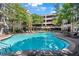 Resort-style pool with lounge chairs in a beautiful community setting at 1850 Cotillion Dr # 2304, Dunwoody, GA 30338