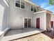 Townhome backyard featuring a concrete patio with sliding door and storage unit at 2031 Austin Park Cir, Decatur, GA 30032