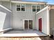 Townhome backyard featuring a concrete patio with sliding door and storage unit at 2031 Austin Park Cir, Decatur, GA 30032