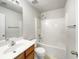 Full bathroom with combination shower-tub, white tile, and updated vanity at 2031 Austin Park Cir, Decatur, GA 30032