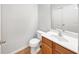Cozy half-bathroom with a wood vanity, laminate floors and neutral color at 2031 Austin Park Cir, Decatur, GA 30032