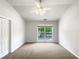 Neutral bedroom featuring a ceiling fan, natural light, and closet space at 2031 Austin Park Cir, Decatur, GA 30032