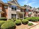 Beautiful townhome with brick facade, manicured landscaping, and a covered porch at 2031 Austin Park Cir, Decatur, GA 30032