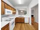 Cozy eat-in kitchen features an open layout, white appliances and light wood cabinets at 2031 Austin Park Cir, Decatur, GA 30032