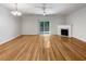 Bright living room with fireplace, hardwood floors, and access to the outdoors at 2031 Austin Park Cir, Decatur, GA 30032
