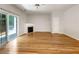 Bright living room features hardwood floors, fireplace, and sliding glass door at 2031 Austin Park Cir, Decatur, GA 30032