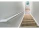 Carpeted staircase with white railing leading to the upper level of the home at 2031 Austin Park Cir, Decatur, GA 30032