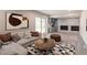 Cozy basement living area with a stone fireplace, modern decor, and natural light at 2146 Chevy Chase Ln, Decatur, GA 30032