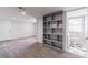 Finished basement area with recessed lighting, carpet, built-in shelving, and adjacent half-bathroom at 2146 Chevy Chase Ln, Decatur, GA 30032