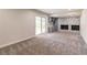 Spacious basement area with a fireplace, walkout access, and neutral carpeting at 2146 Chevy Chase Ln, Decatur, GA 30032