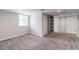 Finished basement area featuring carpet, large window for natural light, and ample storage at 2146 Chevy Chase Ln, Decatur, GA 30032