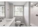 Clean bathroom featuring modern fixtures, white vanity, walk-in shower, and mosaic tile floors at 2146 Chevy Chase Ln, Decatur, GA 30032