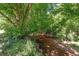 Picture of a creek winding through a peaceful, secluded wooded area, perfect for nature lovers at 220 Mountain Creek Rd, Bowdon, GA 30108