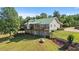 View of the exterior of the home including a two-story deck at 220 Mountain Creek Rd, Bowdon, GA 30108