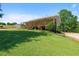 Charming home featuring a green roof, spacious porch, landscaped yard, and scenic views at 220 Mountain Creek Rd, Bowdon, GA 30108