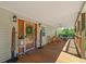 Cozy front porch with wooden railings, seating, and charming decor welcomes you to this delightful home at 220 Mountain Creek Rd, Bowdon, GA 30108