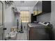 Functional laundry room with modern appliances, ample storage, and practical design, grey color at 220 Mountain Creek Rd, Bowdon, GA 30108