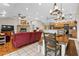 Open living space with a kitchen, dining area, and living room, perfect for entertaining guests, with hardwood floors throughout at 220 Mountain Creek Rd, Bowdon, GA 30108