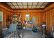 Inside the shed, tools and miscellaneous items are neatly arranged on shelves, offering lots of storage solutions at 220 Mountain Creek Rd, Bowdon, GA 30108