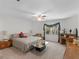Bedroom featuring a king-size bed, ceiling fan, and a desk near a window at 3500 Lost Valley Dr, Jonesboro, GA 30236