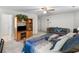 Another view of the bedroom with ceiling fan, TV cabinet, and comfortable seating at 3500 Lost Valley Dr, Jonesboro, GA 30236