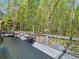 Expansive rear deck overlooks private wooded lot, perfect for relaxing and entertaining in nature at 3500 Lost Valley Dr, Jonesboro, GA 30236