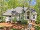 Charming home with a well-manicured lawn, beautiful landscaping, and a welcoming entrance at 3500 Lost Valley Dr, Jonesboro, GA 30236