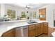Bright kitchen features stainless steel appliances, white countertops, and a breakfast nook with wooded view at 3500 Lost Valley Dr, Jonesboro, GA 30236