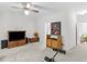 Inviting living area featuring soft gray carpet, a ceiling fan, and natural wood furnishings at 3500 Lost Valley Dr, Jonesboro, GA 30236