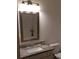 Bathroom features granite countertop, modern vanity and framed mirror at 840 United Se Ave # 408, Atlanta, GA 30312