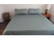 Comfortable bedroom with a queen bed, end tables, and carpeted floor at 840 United Se Ave # 408, Atlanta, GA 30312