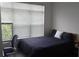 Well-lit bedroom featuring a bed, large window and an office chair at 840 United Se Ave # 408, Atlanta, GA 30312
