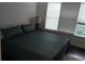 Bedroom featuring a bed next to a bright window for natural light at 840 United Se Ave # 408, Atlanta, GA 30312