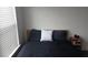 Bedroom featuring a bed, end table, window, and built-in blinds at 840 United Se Ave # 408, Atlanta, GA 30312