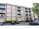 A modern building with many apartments, balconies, parking spaces, trees, and various cars at 840 United Se Ave # 408, Atlanta, GA 30312
