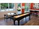 Game room includes a shuffleboard table, seating, and large windows for a bright, entertaining space for residents at 840 United Se Ave # 408, Atlanta, GA 30312