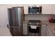 Modern kitchen with stainless steel appliances and granite countertops at 840 United Se Ave # 408, Atlanta, GA 30312