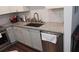 Kitchen sink with granite countertops and gray cabinets at 840 United Se Ave # 408, Atlanta, GA 30312