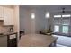 Open concept kitchen with granite countertops, stainless steel appliances, and natural light at 840 United Se Ave # 408, Atlanta, GA 30312