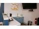 Kitchenette area with white countertops, blue cabinets, sink, and coffee maker perfect for tenants and their convenience at 840 United Se Ave # 408, Atlanta, GA 30312