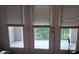 A large patio door with wooden blinds and panes of glass allowing lots of natural light at 840 United Se Ave # 408, Atlanta, GA 30312